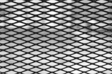 Black metal mesh. Texture. Horizontal frame.