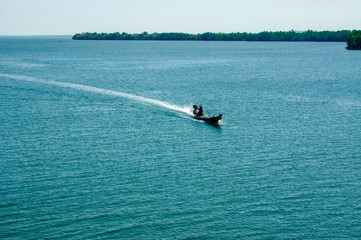 Fototapeta na wymiar Long tail boat in Pumrieng river mouth Surat Thani Thailand