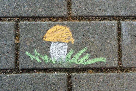 Children's drawing with chalk on asphalt.