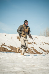 Naklejka premium Special forces action shooting and moving rifle firearm outdoor training