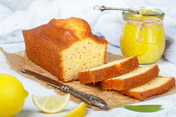 Homemade pound cake with lemon and jam. Traditional treat for tea. Citrus loaf cake. Selective focus - 268529036