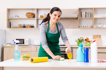 Young female contractor doing housework 