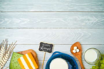 Milk and dairy products on wooden background. Top view from above