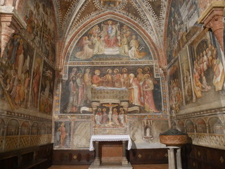 Obraz premium Collegiata church of St Mary in Castell'Arquato. The interior has sculpted capitals, sculptures, baptismal pieve and frescoes. 