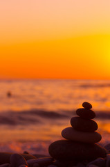 stack of zen stones on pebble beach