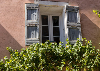 Fototapeta na wymiar Old house with wooden shutters, Provence, France.