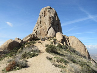 View at the peak of Tom's Thumb with tourists and hikers in the McDowell Mountain range in the Sonoran Desert