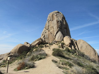 View at the peak of Tom's Thumb with tourists and hikers in the McDowell Mountain range in the Sonoran Desert