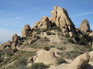 View of a trail with hikers on the path to Tom's Thumb in the McDowell Mountains in the Sonoran desert near Scottsdale, Arizona 