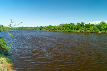 Spring landscape in rural terrain with river