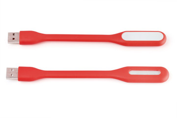 USB red plastic LED light lamp, isolated on a white background. Closeup.