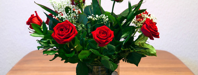 Red roses bouquet -  nature panorama or banner of beautiful flowers.