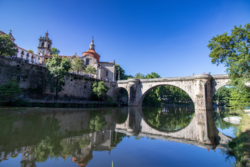 Fototapeta na wymiar church and old bridge over the river in Amarante Portugal