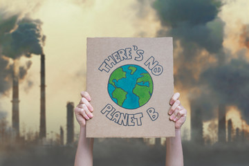 Climate change manifestation poster on an industrial fossil fuel burning background: there is no...