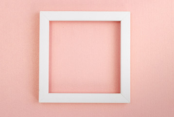 White square frame on a pink pearl design board.