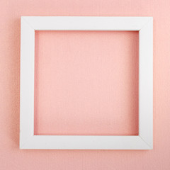 White square frame on a pink pearl design board.