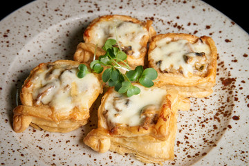 Baked stuffed puff pastry on a platter.
