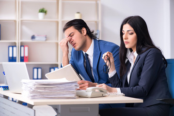 Two employees working in the office 