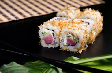 Japanese sushi and rolls on a black background