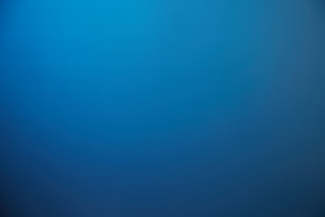 Fototapeta premium Blue background turning from a light shade to a dark shade