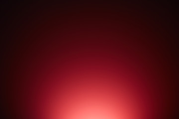 Red background turning from a light shade below to a dark shade above