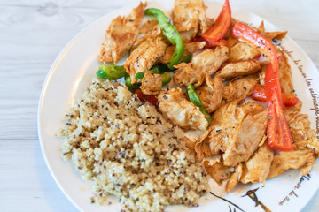 Seitan vegan chicken fillet with quinoa and organic peppers