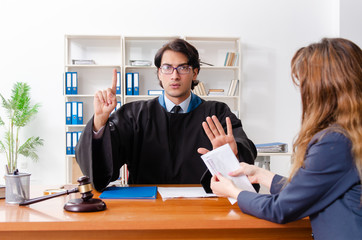 Young woman visiting male lawyer 