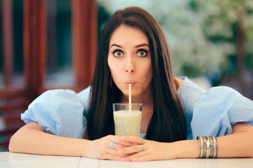 Summer Woman Drinking Fruit Juice in a Restaurant 
