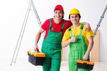 Two workers contractors working indoors  