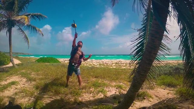 Fruit Ninja in real life, man cutting a coconut with a sword, slowmotion.