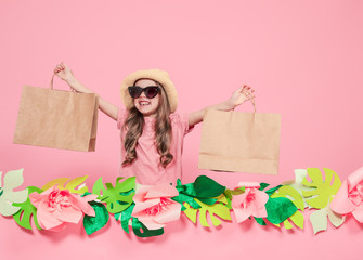 Obraz na płótnie Canvas Portrait of cute little girl with shopping bag