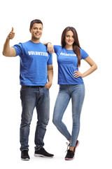 Obraz premium Young volunteers posing and showing thumbs up