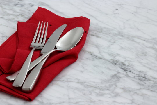 beautiful silverware on fine napkin