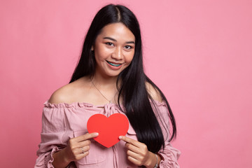 Asian woman with red heart.