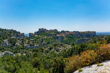 Fototapeta na wymiar Landscape with rocks of Alpilles mountains in Provence, South of France