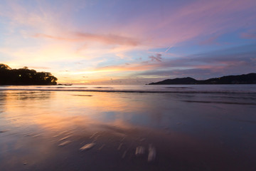 Fototapeta na wymiar Sunset at Patong beach Thailand motion blur water