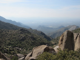 View from Tom's Thumb in the McDowell Mountain range in the Sonoran desert near Scottsdale, Arizona, with a rocky landscape and blue sky 