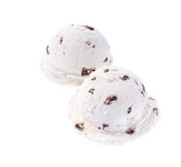 white ice cream with black chocolate pieces isolated on white background, diagonal composition