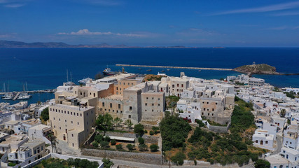 Fototapeta na wymiar Aerial drone photo of iconic port of Naxos island featuring uphill castle and beautiful Temple of Apollon or Gate, Cyclades, Greece