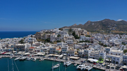 Aerial drone photo of iconic chora, main town of Naxos island featuring beautiful uphill castle...