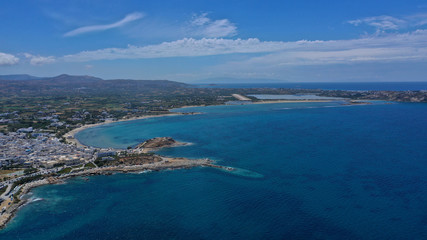Aerial drone photo of iconic port of Naxos island featuring uphill castle and beautiful Temple of...