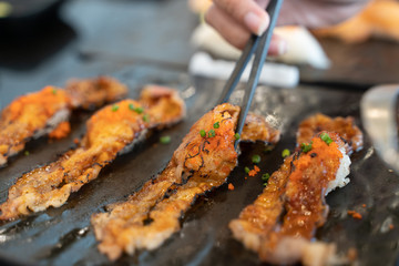 Eating Sushi with chopsticks. Fresh sushi japanese food in restaurant.