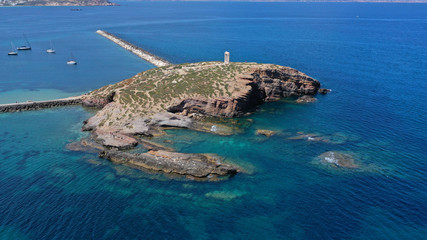 Aerial drone panoramic view of iconic and unique Temple of Apollon or Portara (Gate) with breathtaking views to port - town and castle of Naxos island and the Aegean blue sea, Cyclades, Greece