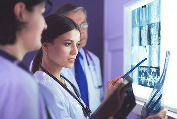 Hospital doctors looking at x-rays in an emergency room