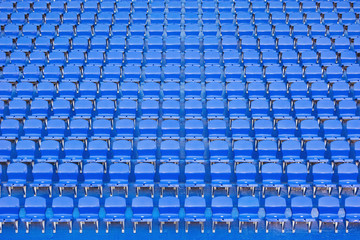 Fototapeta premium Blue empty seats on the tribune of the new stadium.