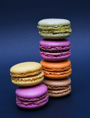 colorful macaroons on purple background