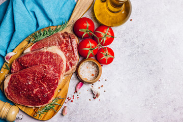 Fresh raw Black Angus beef steak on wooden board