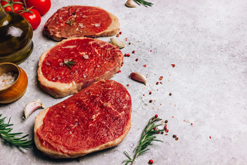 Fresh raw Black Angus beef steak on wooden board
