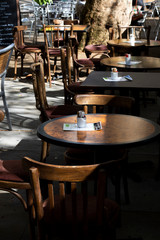 Fototapeta na wymiar empty tables and chairs outside restaurant 