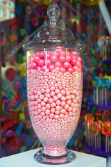 Glass jar filled with colorful candy in a store window in Chicago